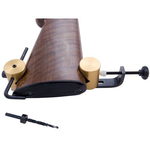 Le SLING SWIVEL DRILL JIG de KLEINENDORST garantit un perçage précis et sans éclats, s'adapte à toutes les crosse et évite d'endommager le bois.